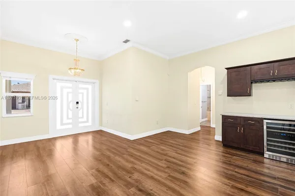 a view of a kitchen with wooden floor and a sink