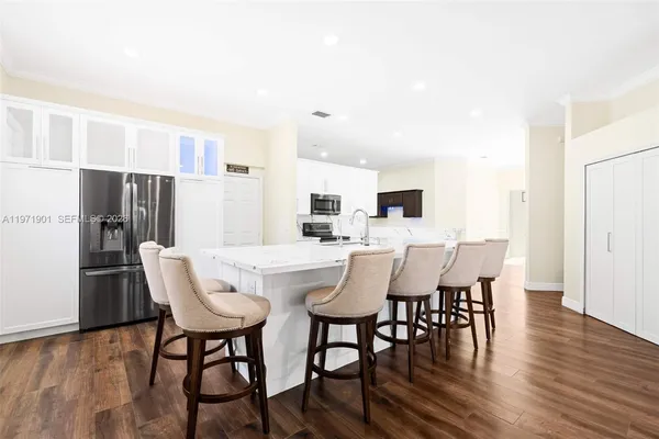 a view of a dining room with furniture and wooden floor