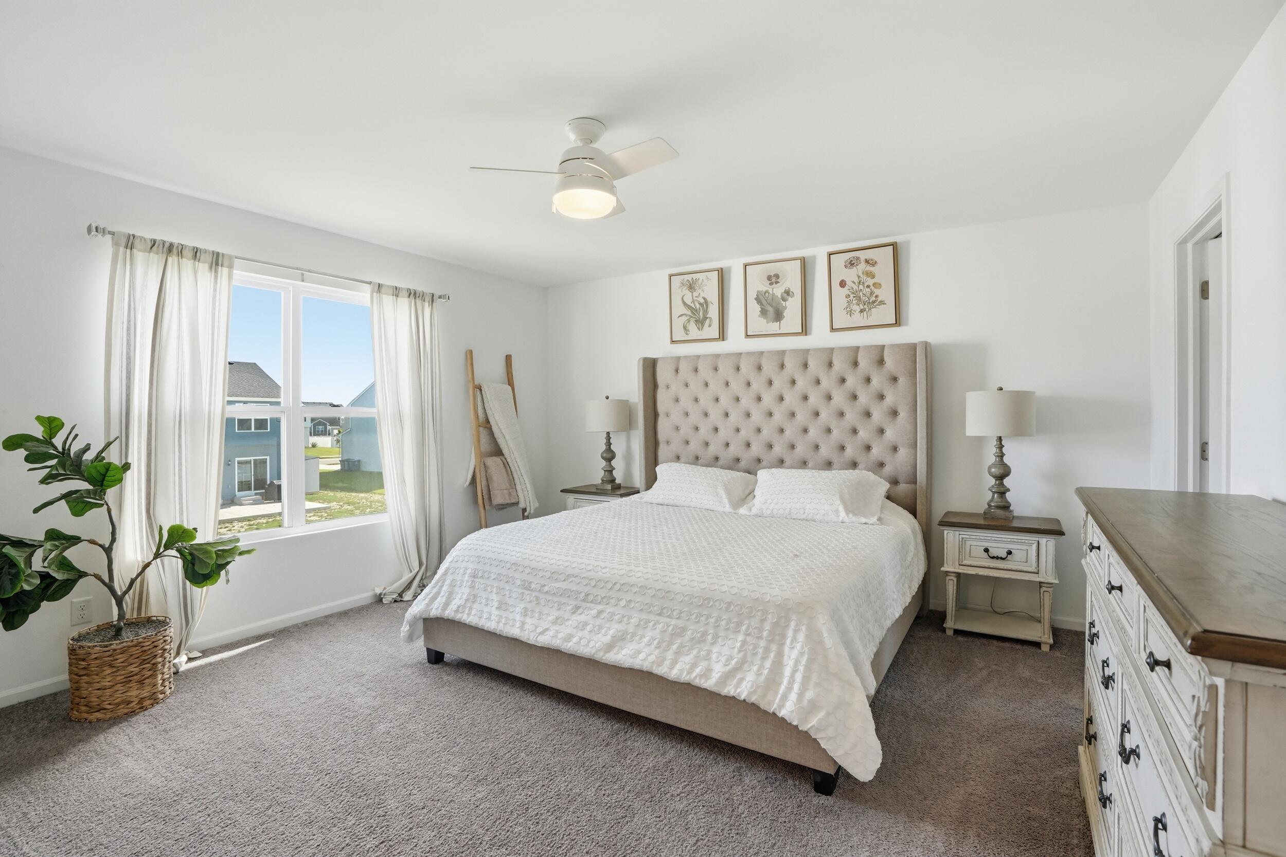 8658 Valley Forge Way Lowell, IN 46356 - Photo 14 of 23 a bedroom with a large bed and a chandelier