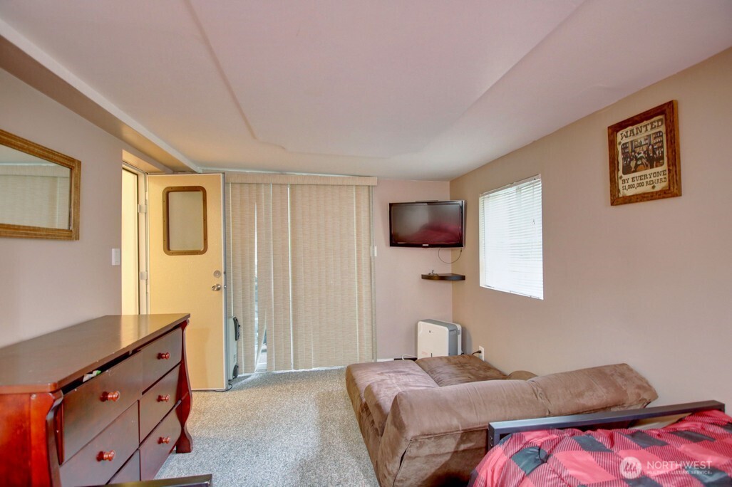35 Branch Circle Maple Falls, WA 98266 - Photo 14 of 37 a bedroom with a bed and a flat screen tv