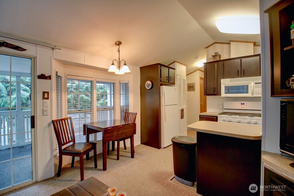 35 Branch Circle Maple Falls, WA 98266 - Photo 10 of 37 a view of a dining room with furniture window and outside view