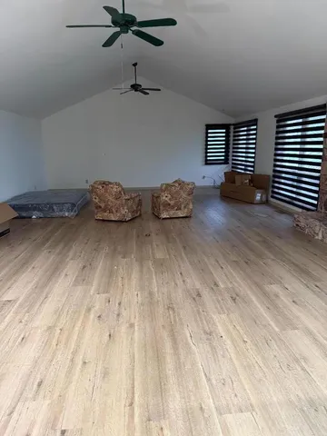 an empty room with a wooden floor
