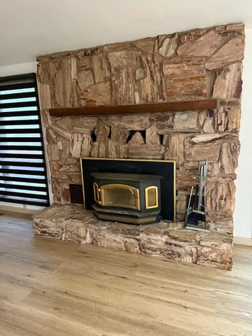 a fireplace with wooden frame