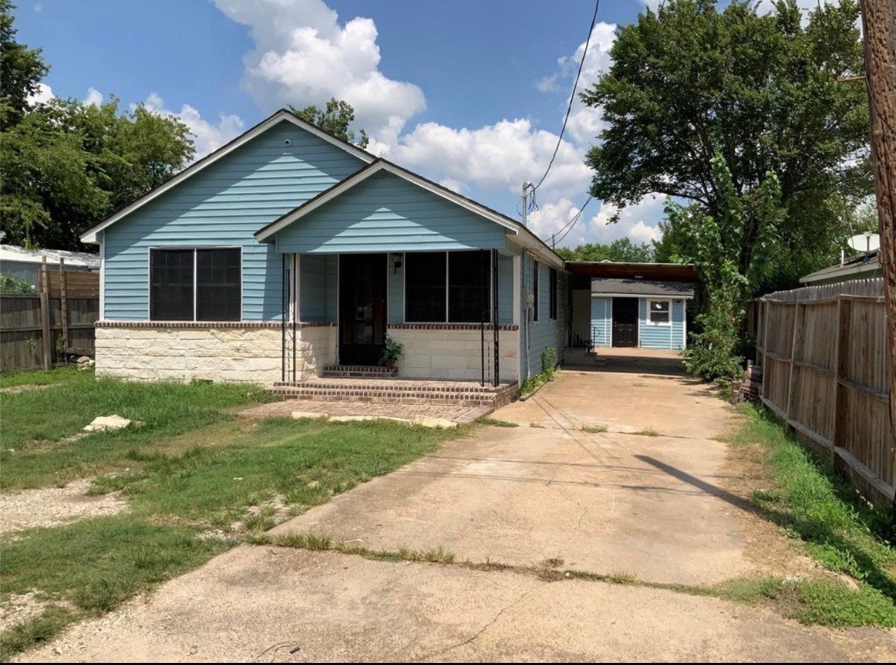 2415 Perry Street Baytown, TX 77521 - Photo 4 of 7 a front view of house with yard and green space