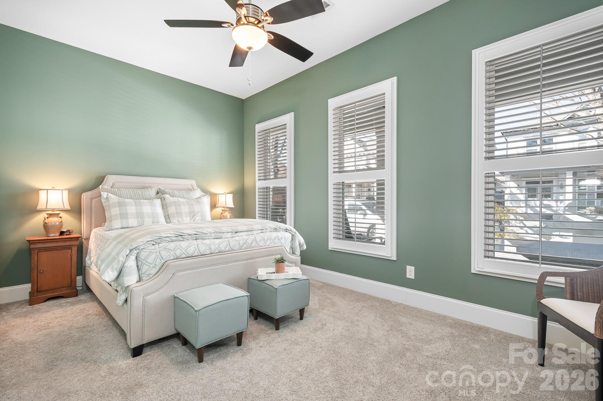 1215 Inn Keepers Way Cornelius, NC 28031 - Photo 15 of 35 a spacious bedroom with a bed and a window