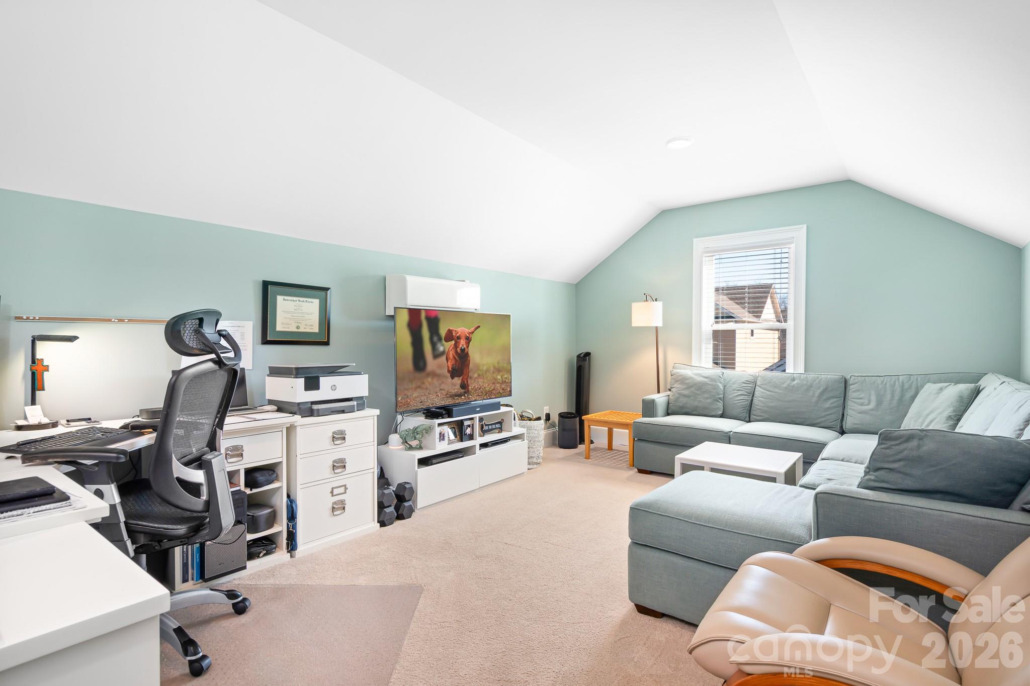 1215 Inn Keepers Way Cornelius, NC 28031 - Photo 17 of 35 a living room with furniture and a flat screen tv