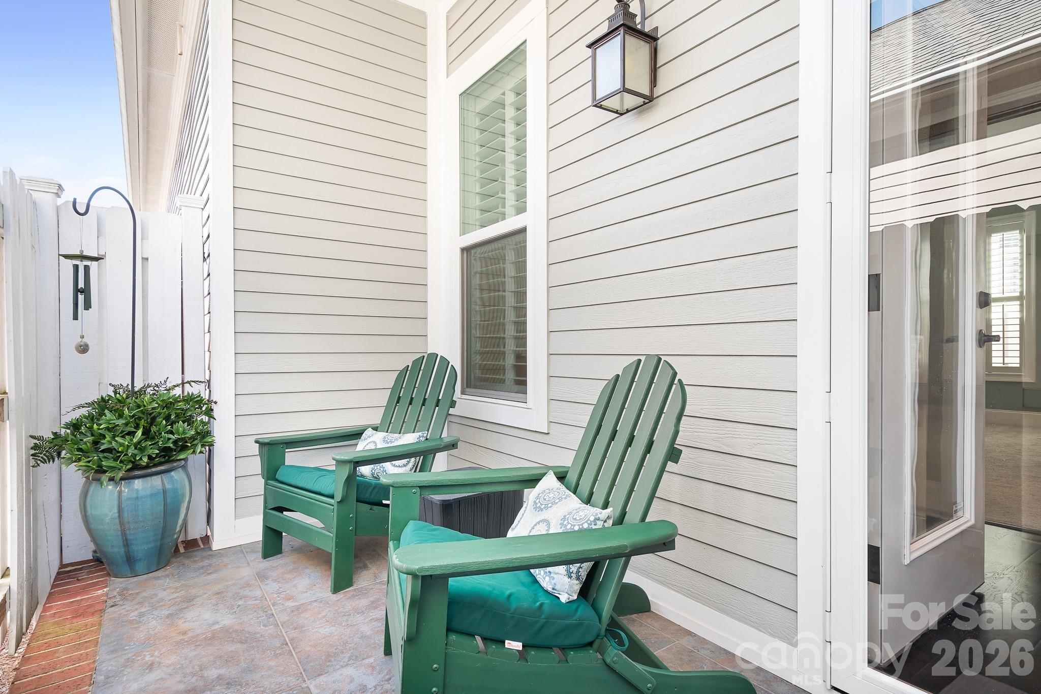 1215 Inn Keepers Way Cornelius, NC 28031 - Photo 19 of 35 a view of a outdoor seating area with potted plants