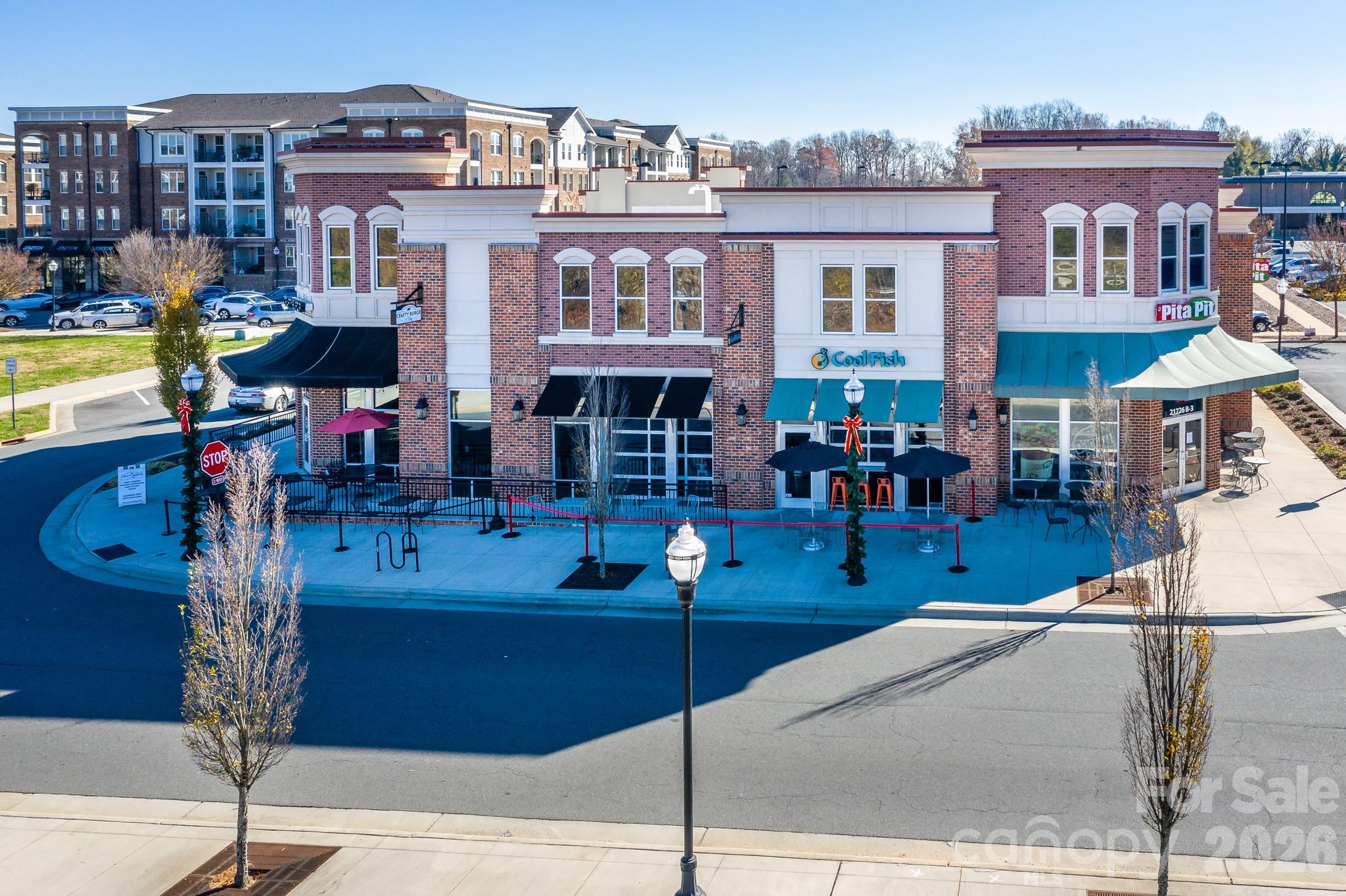 1215 Inn Keepers Way Cornelius, NC 28031 - Photo 26 of 35 a front view of a building with street