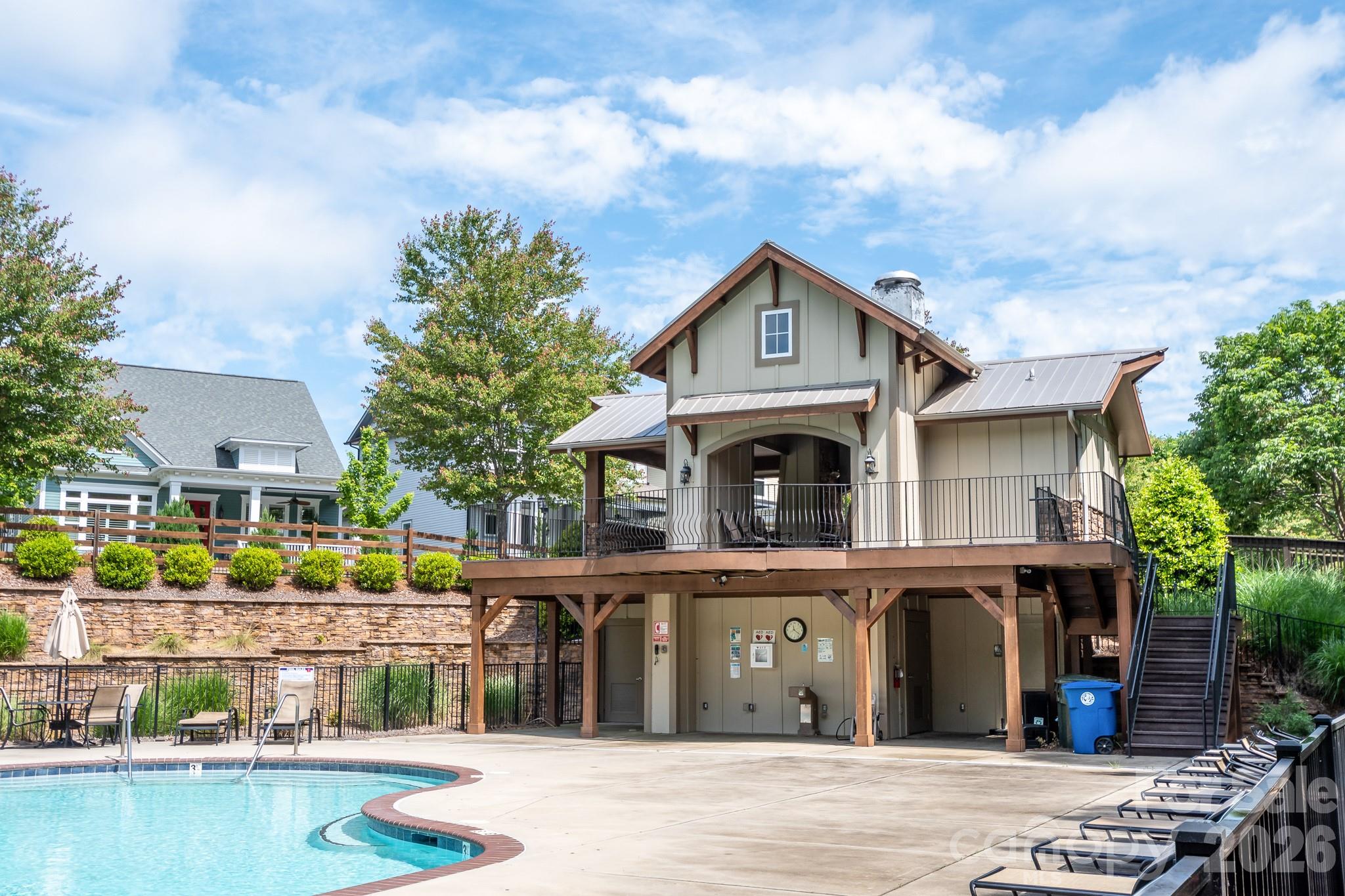 1215 Inn Keepers Way Cornelius, NC 28031 - Photo 31 of 35 a front view of a house with a garden