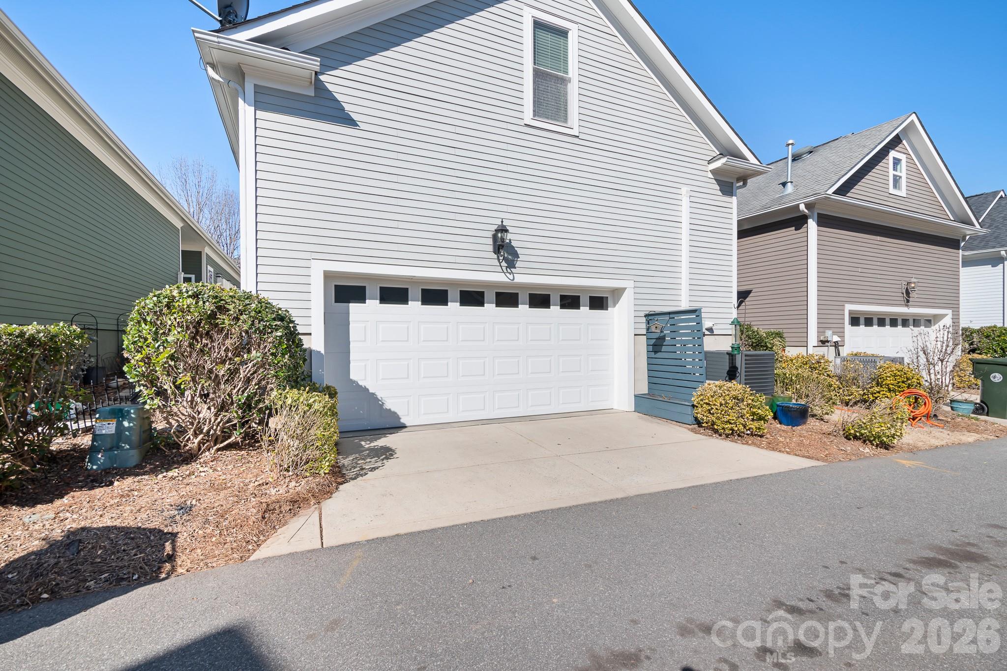1215 Inn Keepers Way Cornelius, NC 28031 - Photo 35 of 35 a front view of a house with a yard and garage