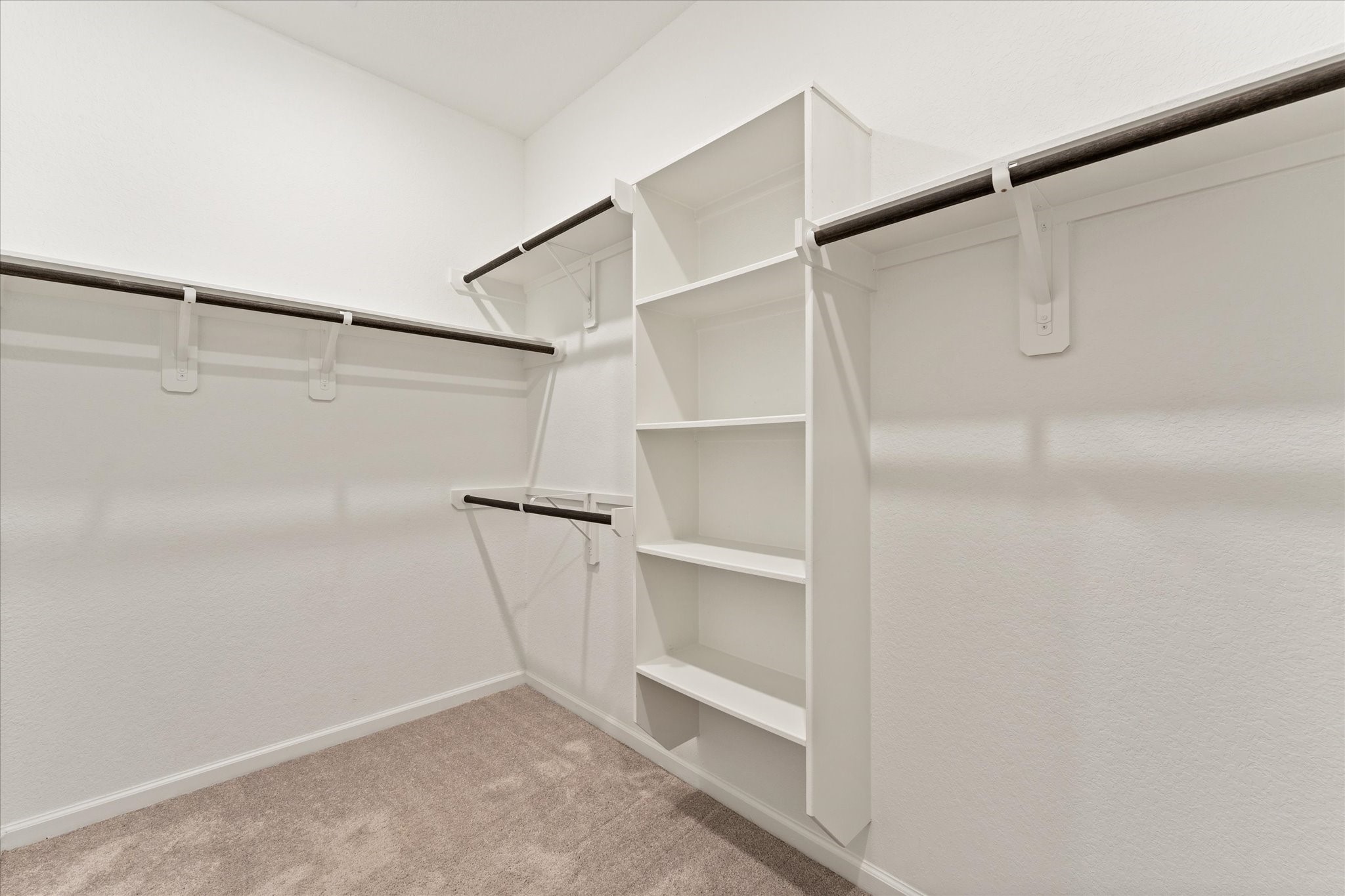 15520 Sunset Maple Court Conroe, TX 77302 - Photo 19 of 46 a view of an empty walk in closet