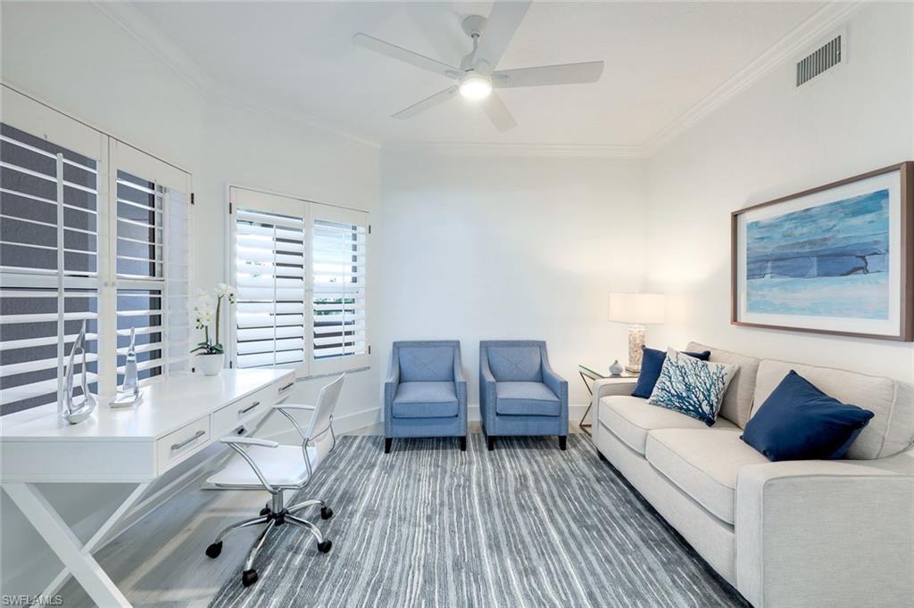 269 Barefoot Beach Boulevard, Unit 403 Bonita Springs, FL 34134 - Photo 18 of 27 Home office with ornamental molding, a ceiling fan, and baseboards