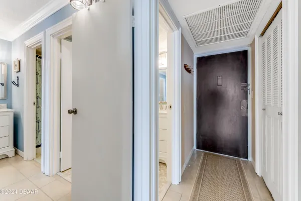 a kitchen with stainless steel appliances granite countertop a stove top oven a sink dishwasher and a refrigerator