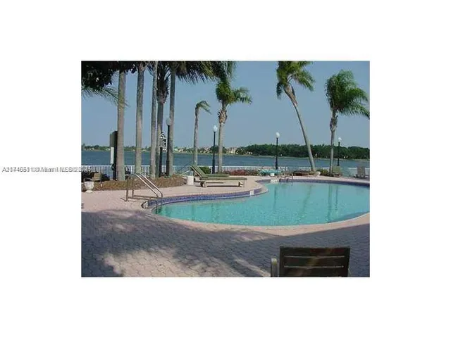 a view of swimming pool with a yard