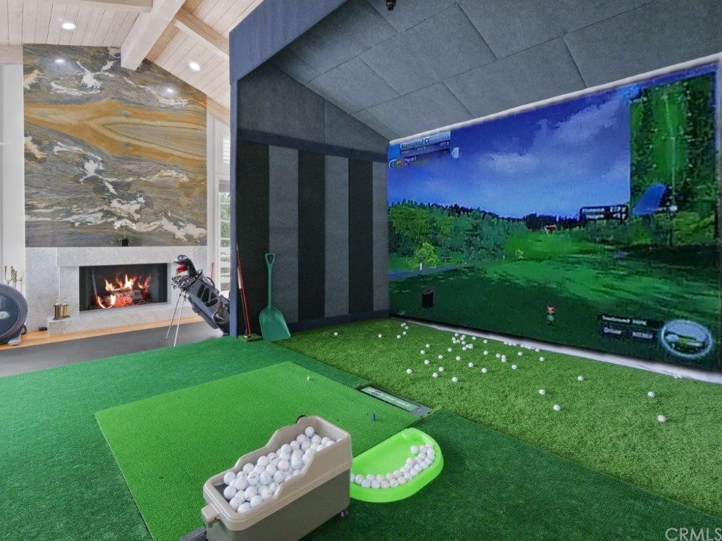 5 Chuckwagon Road Rolling Hills, CA 90274 - Photo 8 of 58 Living Room with Fireplace currently set up with a Golf Simulation Practice Equipment