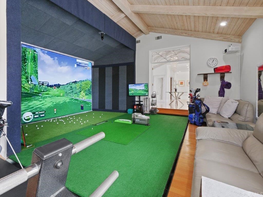 5 Chuckwagon Road Rolling Hills, CA 90274 - Photo 9 of 58 Living Room with Fireplace currently set up with a Golf Simulation Practice Equipment