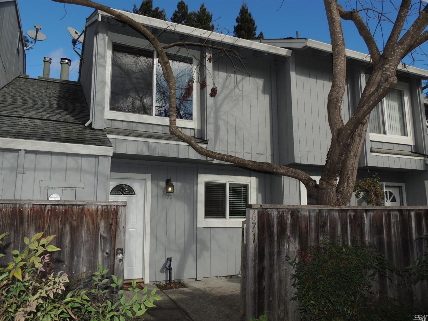 671 Racquet Club Circle Rohnert Park, CA 94928 - Photo 1 of 1 a front view of house and yard with green space