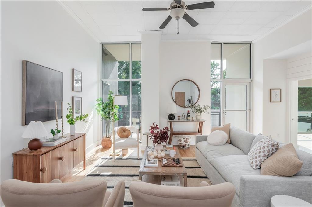 3400 Malone Drive, Unit 208 Atlanta, GA 30341 - Photo 1 of 1 a living room with furniture and a large mirror
