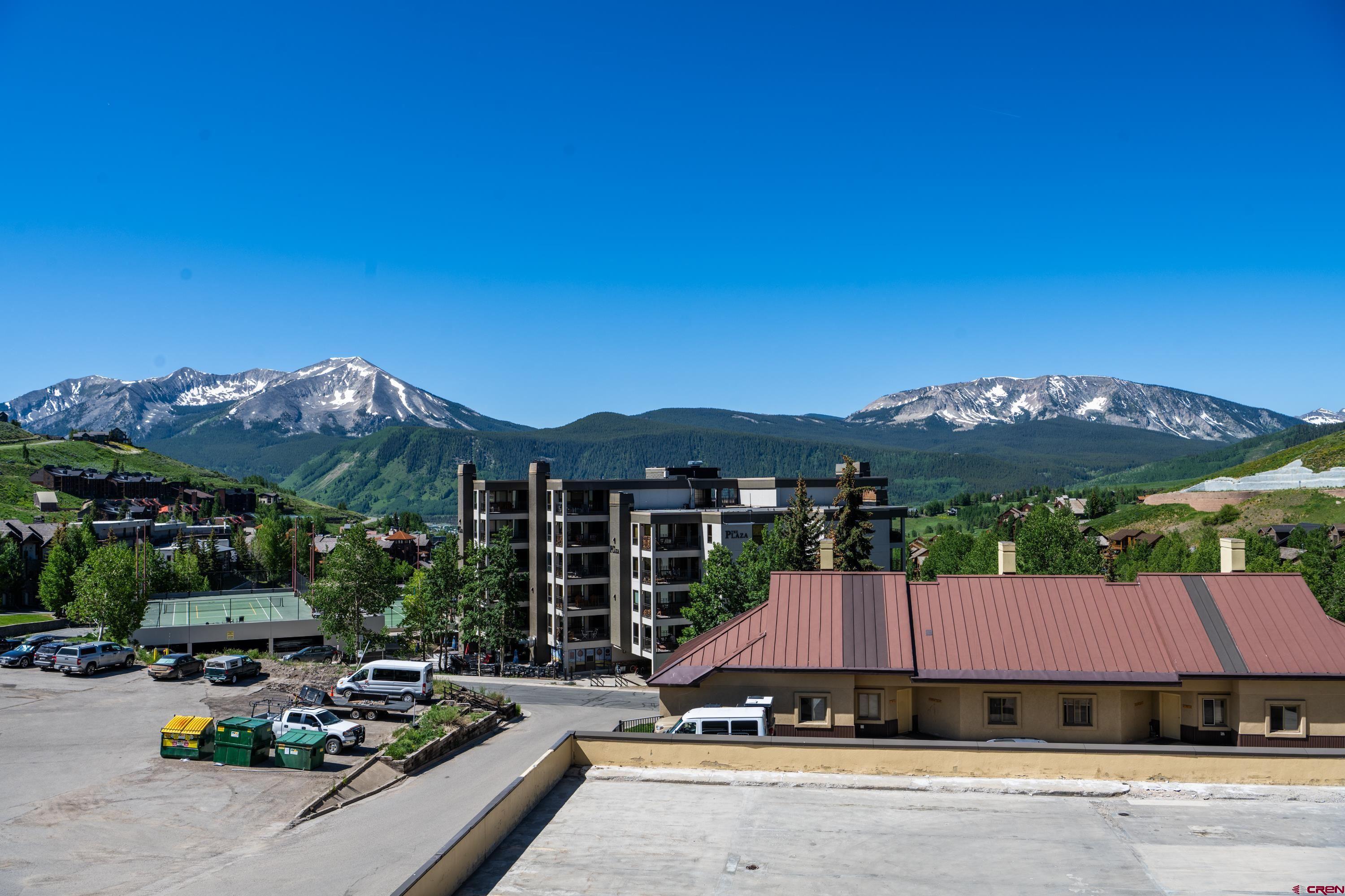 500 Gothic Road, Unit 225 Crested Butte, CO 81225 - Photo 22 of 24 a view of a house with a garden and balcony