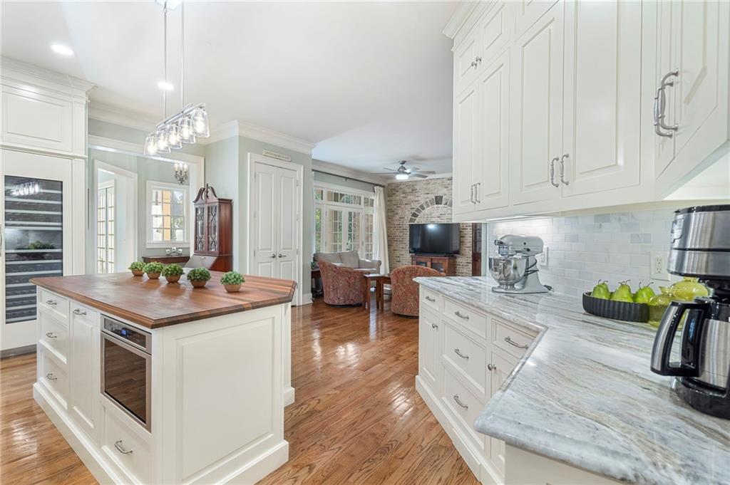 1665 High Trail Southeast Atlanta, GA 30339 - Photo 11 of 53 a kitchen with stainless steel appliances kitchen island granite countertop a stove and a sink