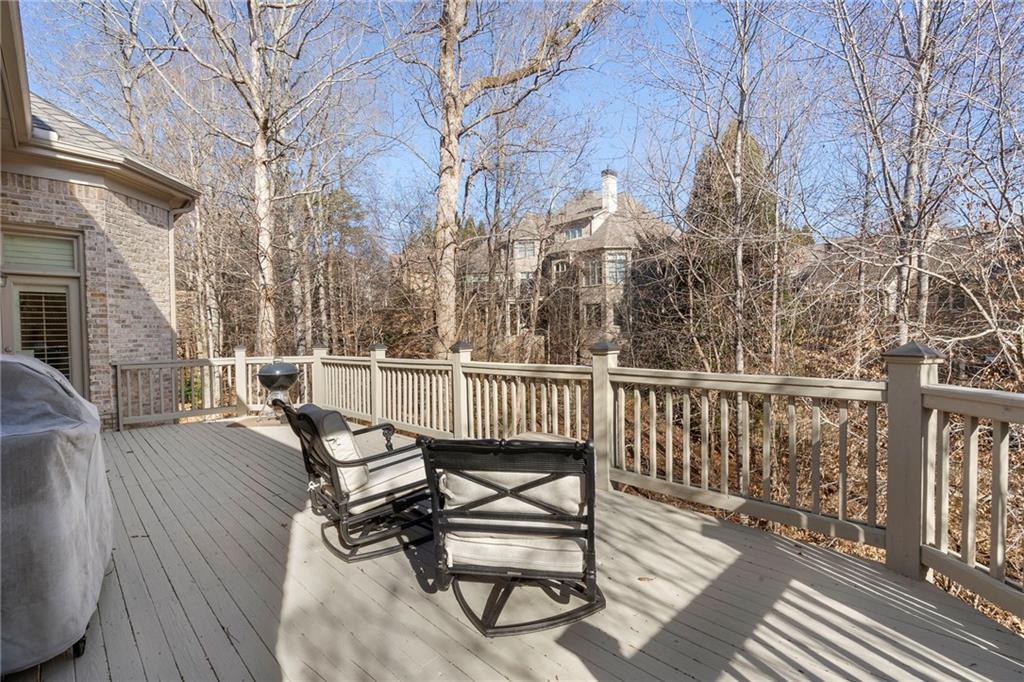 1665 High Trail Southeast Atlanta, GA 30339 - Photo 19 of 53 a view of a roof deck with wooden floor and fence