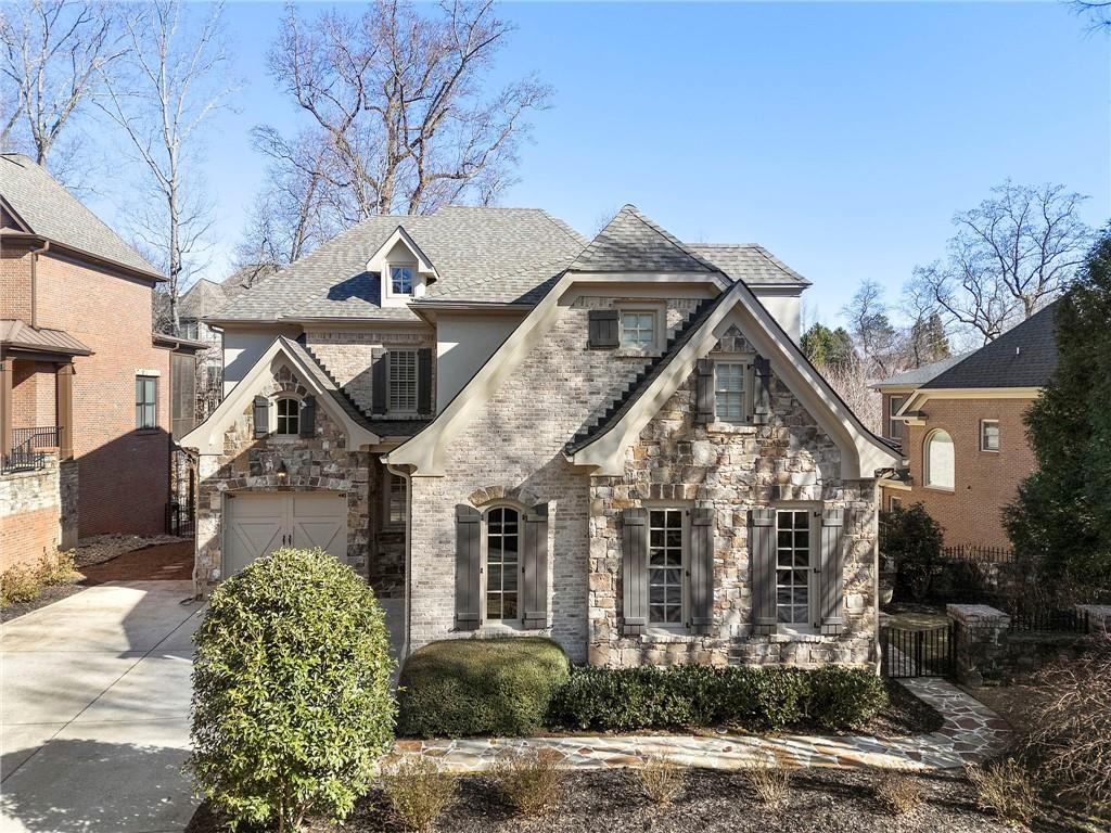 1665 High Trail Southeast Atlanta, GA 30339 - Photo 2 of 53 a front view of a house with garden