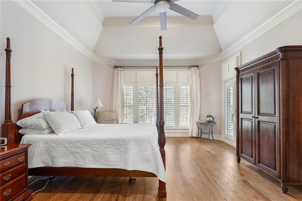 1665 High Trail Southeast Atlanta, GA 30339 - Photo 24 of 53 a bedroom with a bed and wooden floor