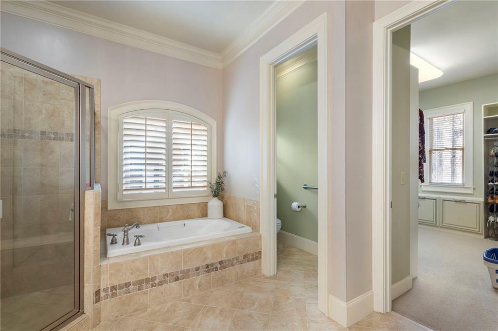1665 High Trail Southeast Atlanta, GA 30339 - Photo 28 of 53 a spacious bathroom with a tub and shower
