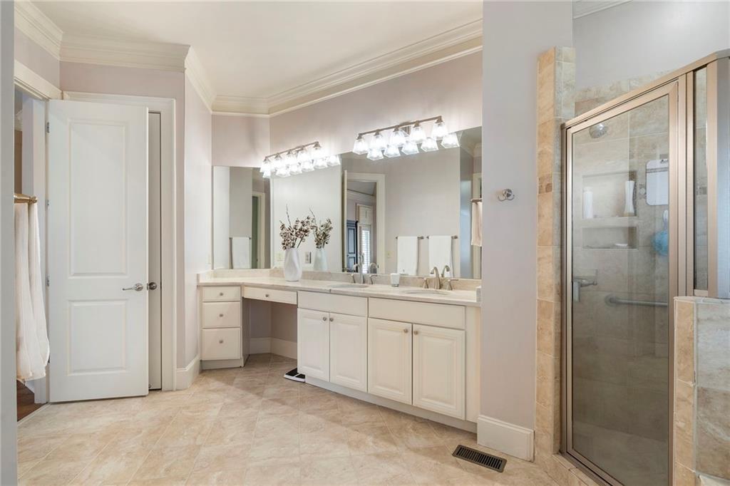 1665 High Trail Southeast Atlanta, GA 30339 - Photo 29 of 53 a bathroom with a double vanity sink mirror and shower