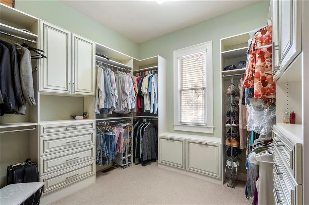 1665 High Trail Southeast Atlanta, GA 30339 - Photo 30 of 53 a view of walk in closet with clothes and shoes