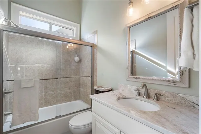 a view of an empty room with window and cabinet