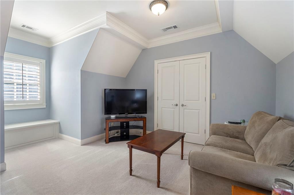 1665 High Trail Southeast Atlanta, GA 30339 - Photo 39 of 53 a living room with furniture and a flat screen tv