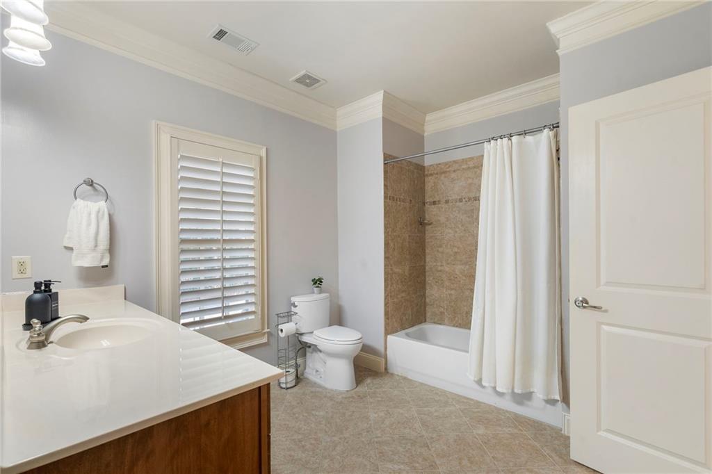 1665 High Trail Southeast Atlanta, GA 30339 - Photo 40 of 53 a bathroom with a sink toilet and shower