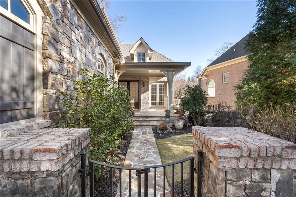 1665 High Trail Southeast Atlanta, GA 30339 - Photo 4 of 53 a front view of house with yard outdoor seating and barbeque oven