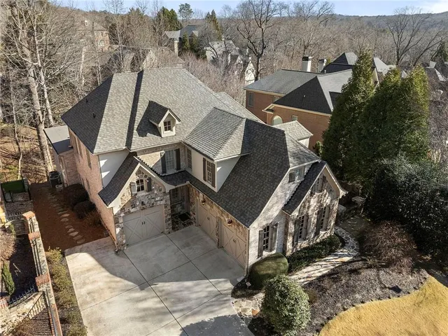 an aerial view of a house with outdoor space