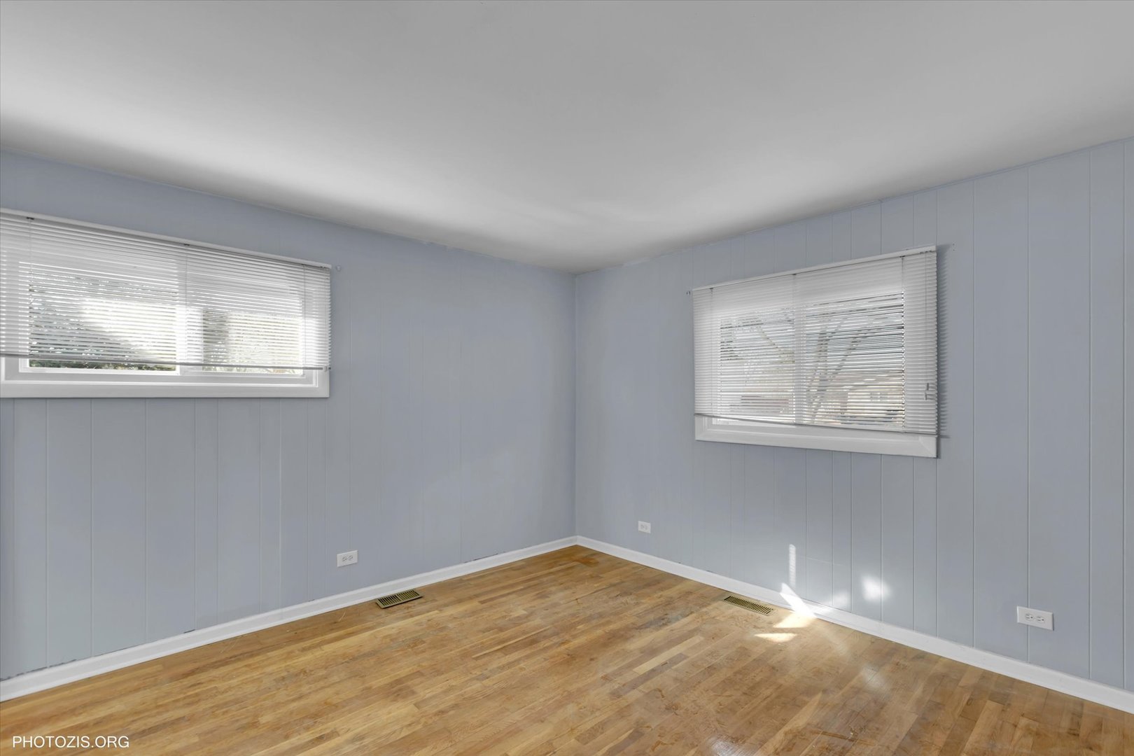 465 Washington Boulevard Hoffman Estates, IL 60169 - Photo 16 of 26 a view of an empty room with wooden floor and a window