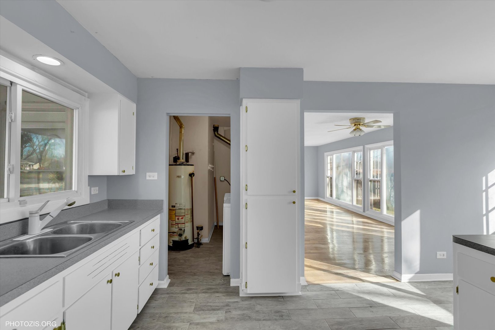 465 Washington Boulevard Hoffman Estates, IL 60169 - Photo 5 of 26 a kitchen with a sink and a refrigerator
