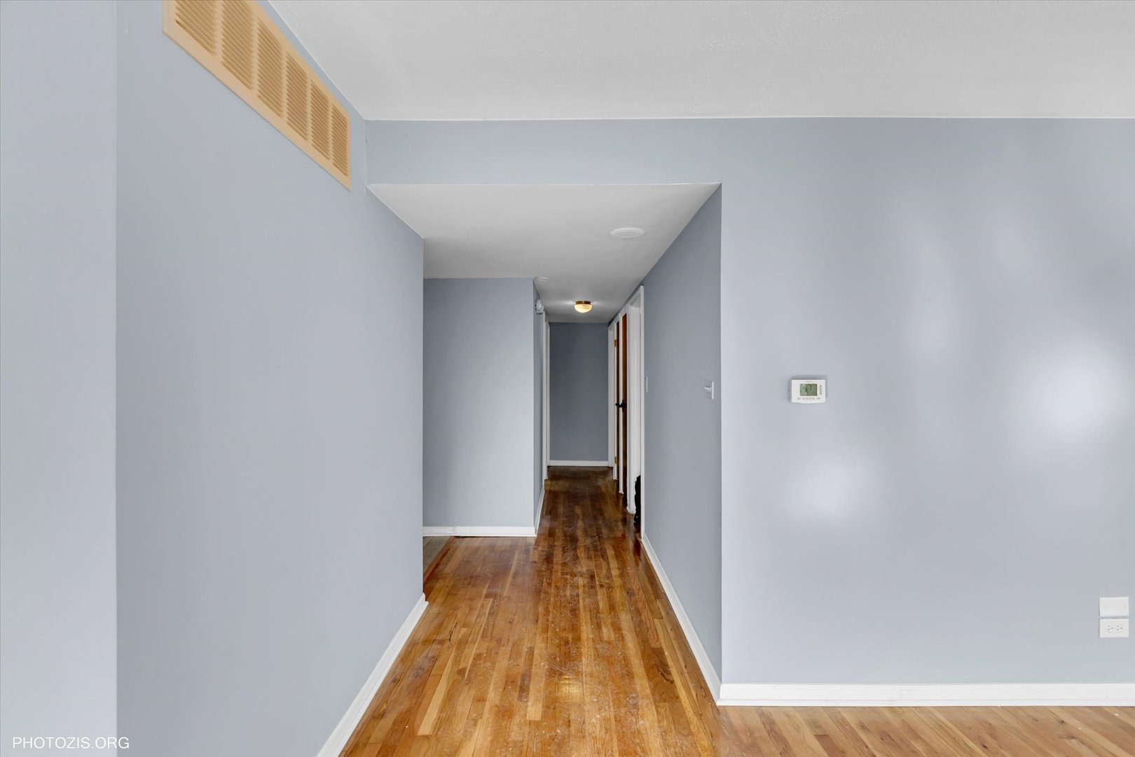 465 Washington Boulevard Hoffman Estates, IL 60169 - Photo 7 of 26 a view of a hallway with wooden floor