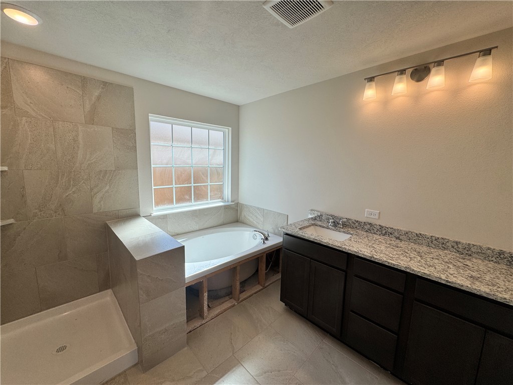 2414 Rooke Road Bryan, TX 77807 - Photo 9 of 11 a room with a sink and a window