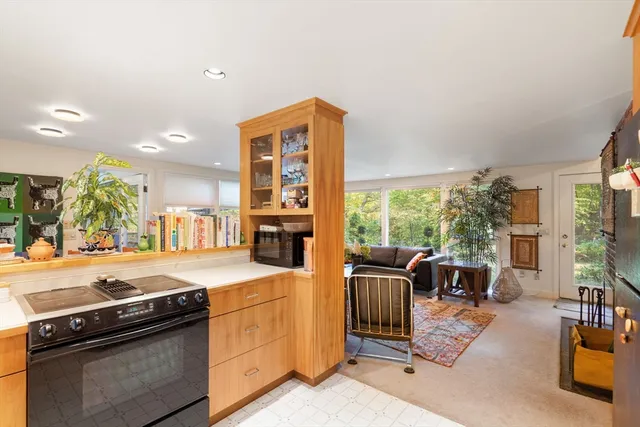 a kitchen that has a sink and a stove top oven