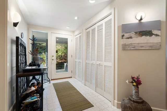 a view of a bedroom with furniture and windows