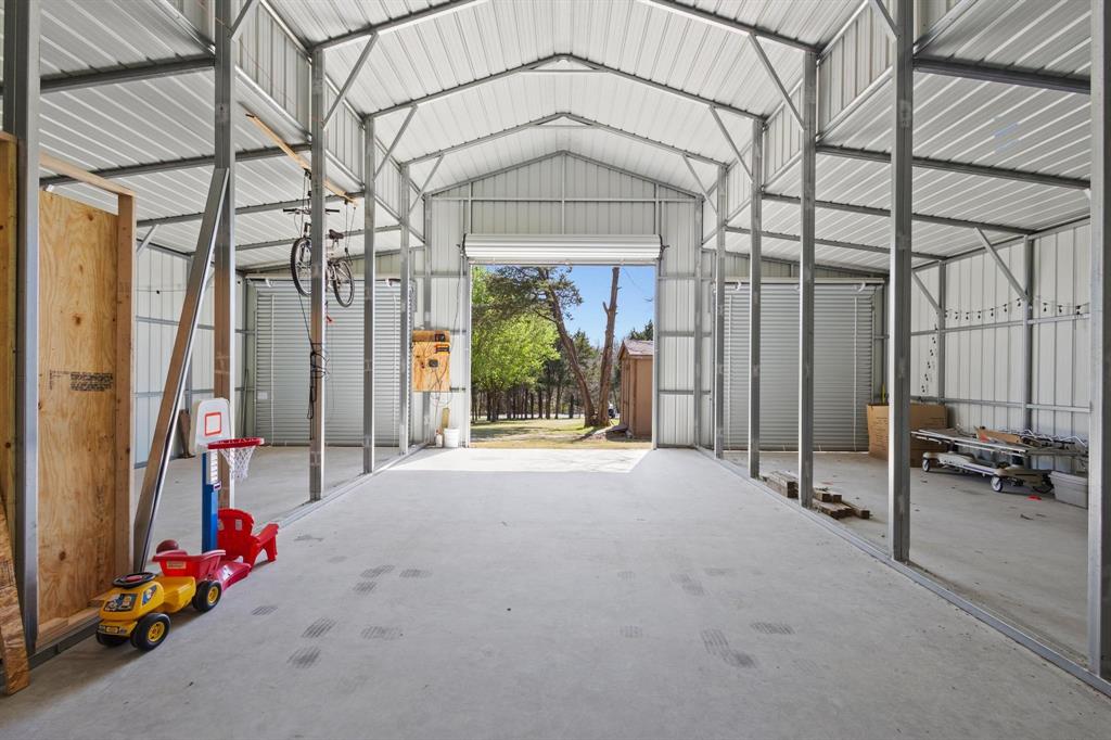 236 Homesite Road Pottsboro, TX 75076 - Photo 13 of 40 a view of a building with a outdoor space
