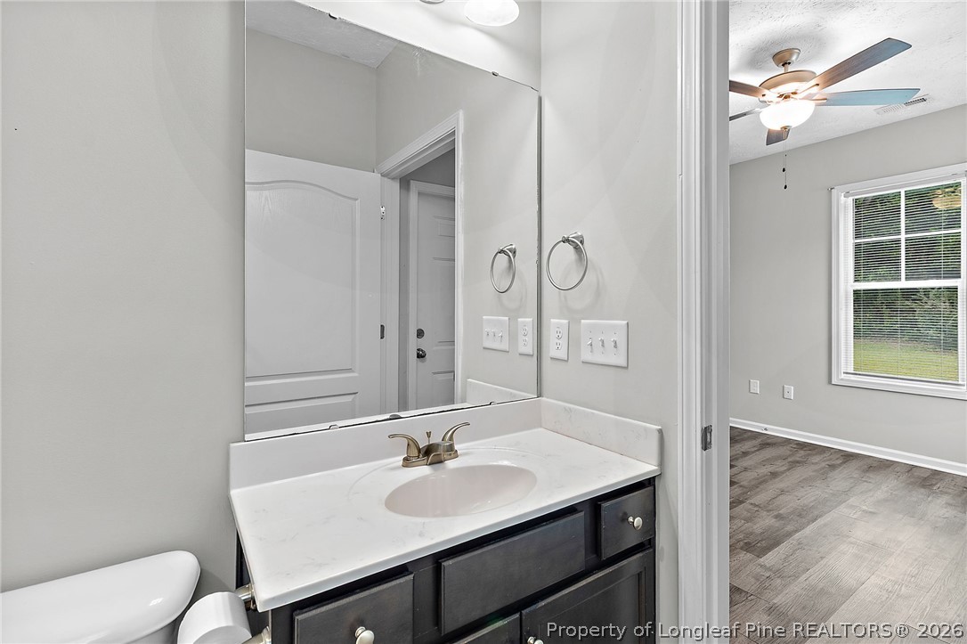 215 Old Wilmington Road Fayetteville, NC 28301 - Photo 17 of 31 a bathroom with a sink and a mirror