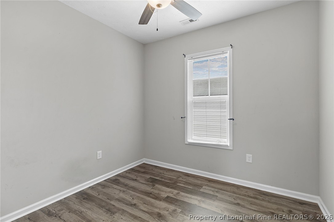 215 Old Wilmington Road Fayetteville, NC 28301 - Photo 18 of 31 an empty room with a window and a fan
