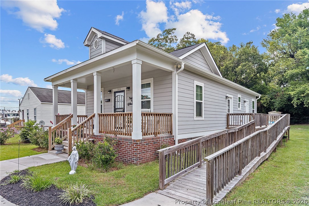 215 Old Wilmington Road Fayetteville, NC 28301 - Photo 25 of 31 a front view of a house with a yard