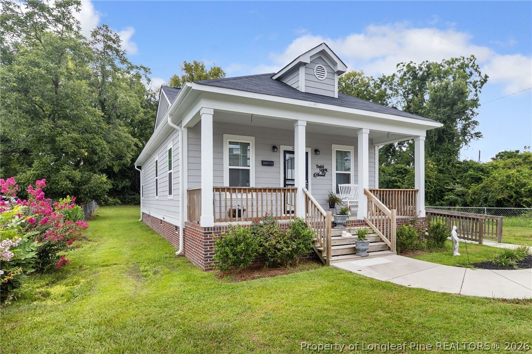 215 Old Wilmington Road Fayetteville, NC 28301 - Photo 27 of 31 front view of a house with a yard