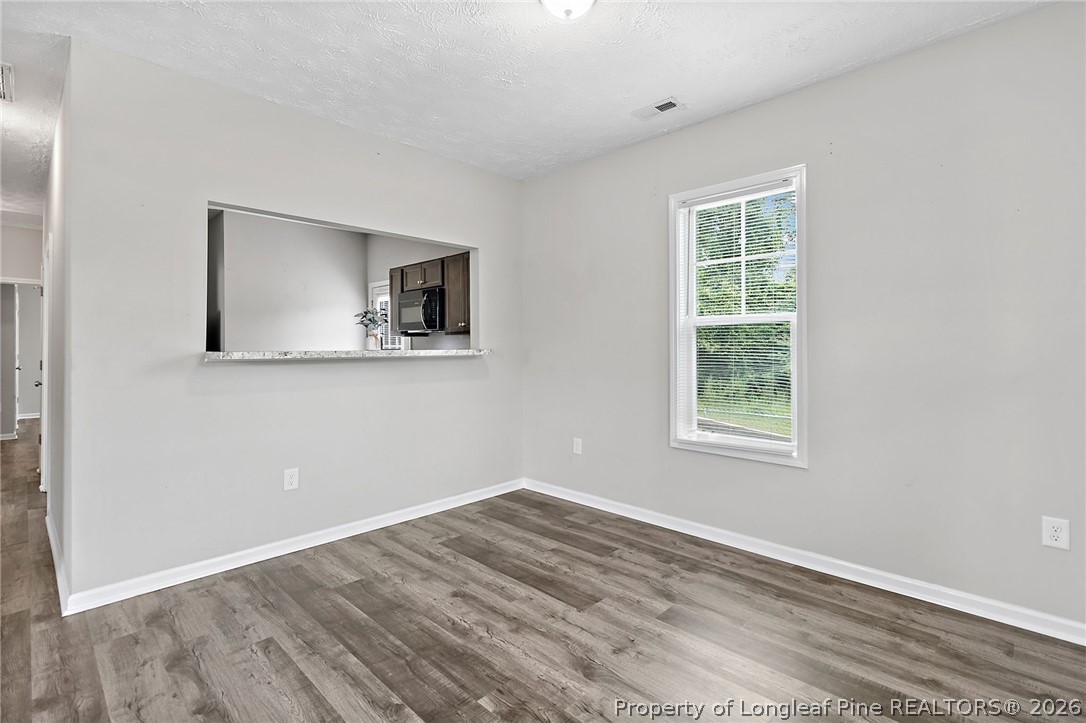 215 Old Wilmington Road Fayetteville, NC 28301 - Photo 6 of 31 a view of a room that has a window in it