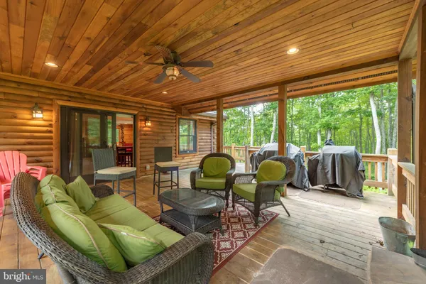 a kitchen with stainless steel appliances a refrigerator a sink dishwasher a stove and white countertops with wooden floor