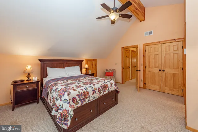 a bedroom with bed and window