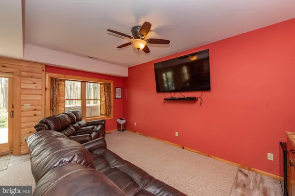 a room with gym equipment and mirror